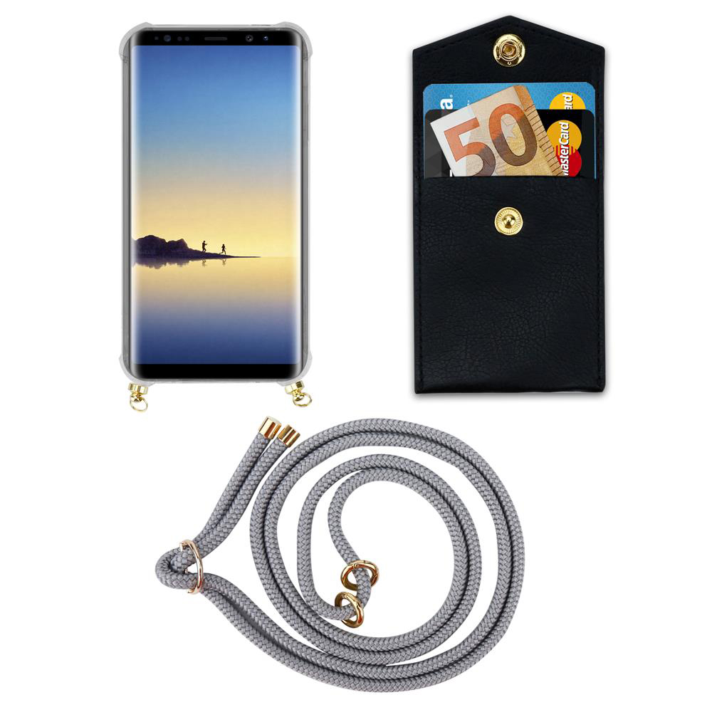 Smartphone con custodia, portafoglio con soldi e carte, cordino su sfondo bianco.