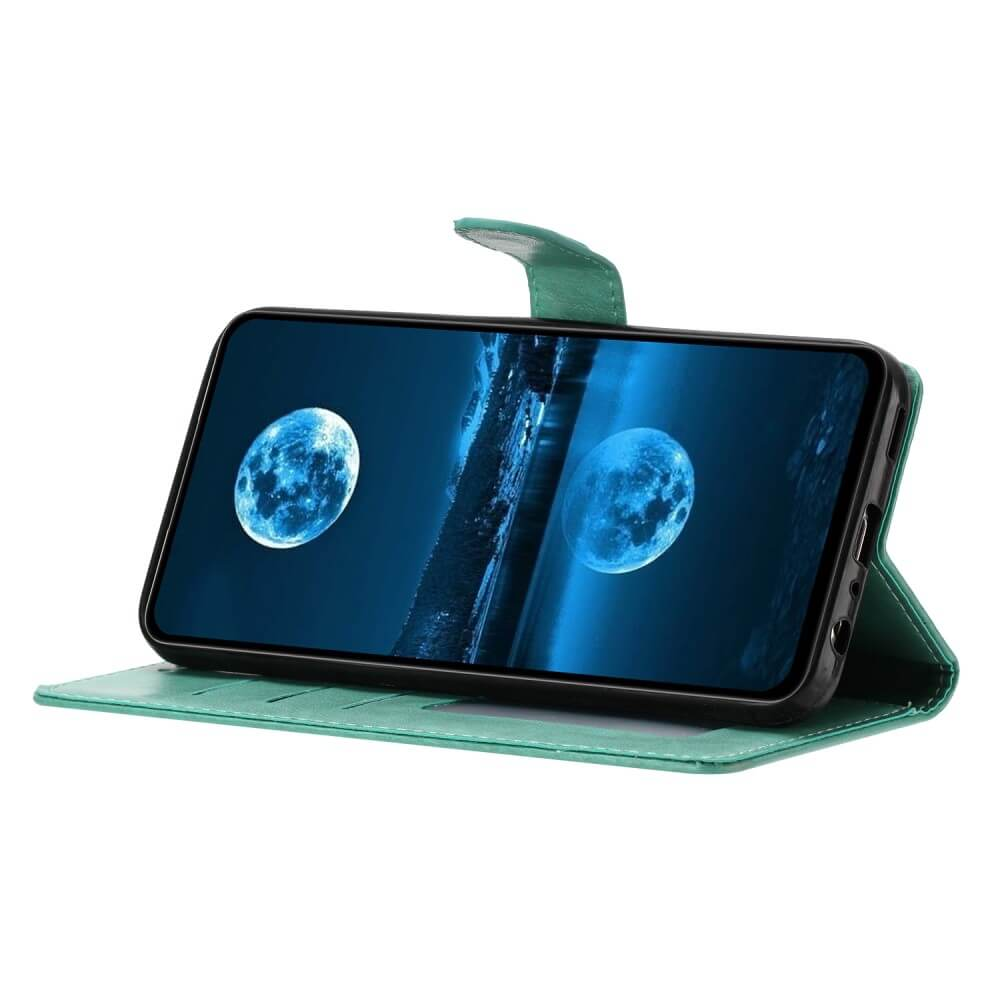 Ein grünes Handycover mit zwei Vollmond-Hintergründen auf dem Bildschirm.