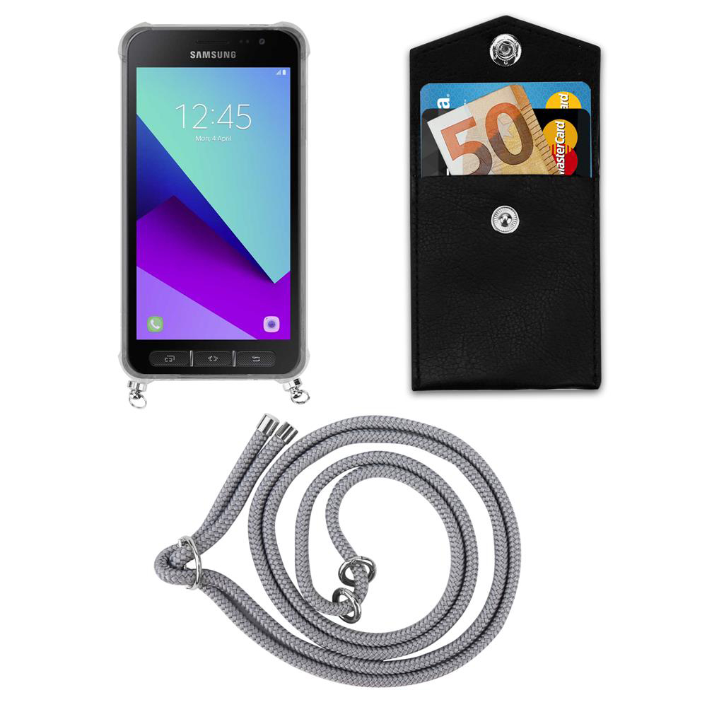 Telefono Samsung con portafoglio, banconota da 50 euro e cordino su sfondo bianco.