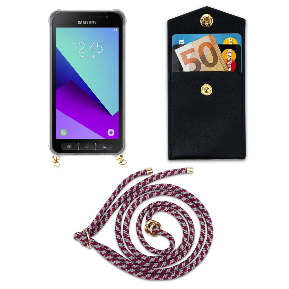 Smartphone Samsung in custodia, portafoglio con soldi e carte, e cordino.