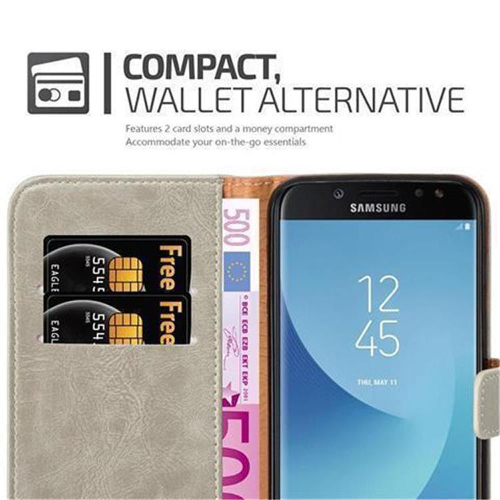 Un portafoglio grigio con due fessure per carte, un telefono e una banconota da 500 euro.