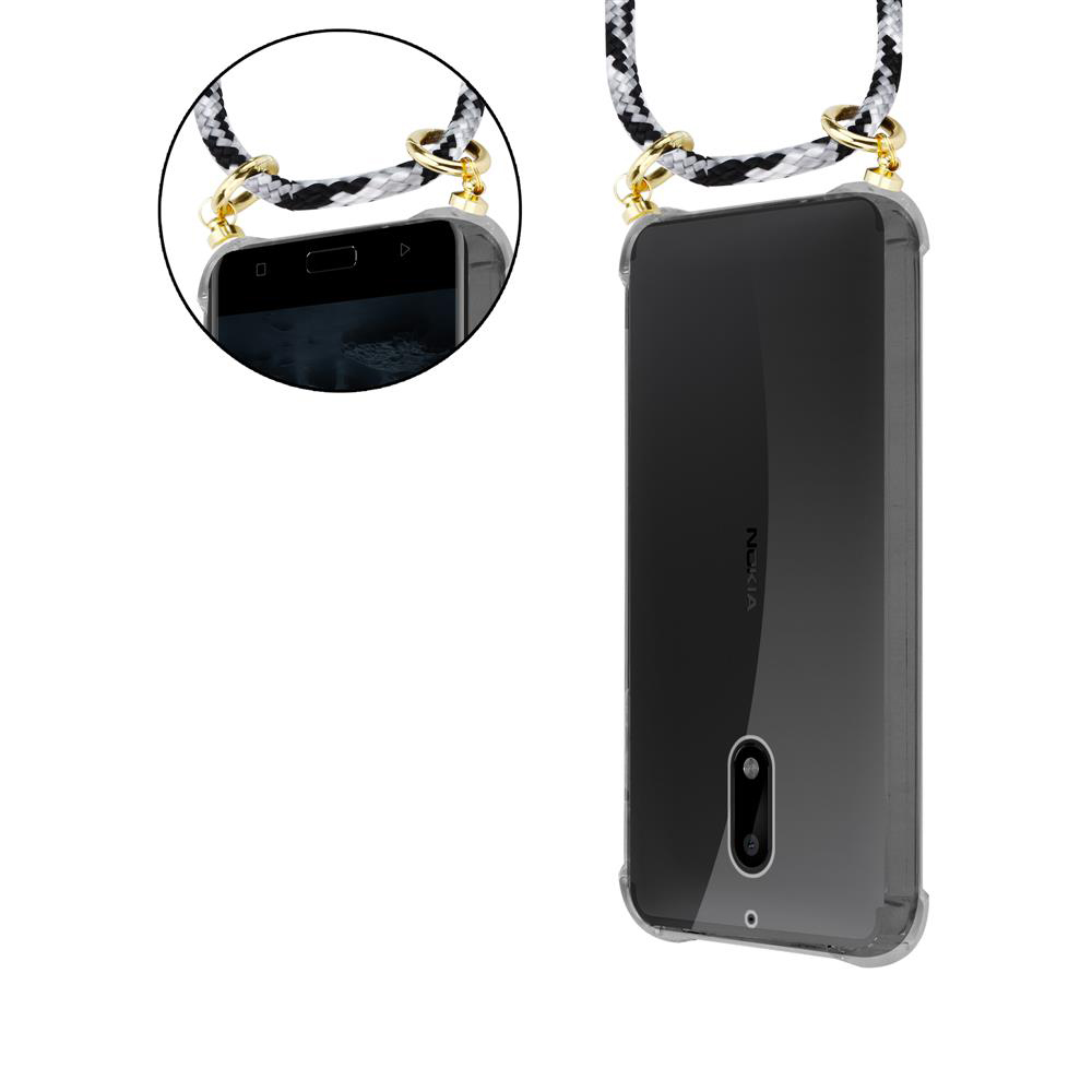 Klare Handyhülle mit schwarz-weißer Kordel an goldenen Schlaufen am Handy.
