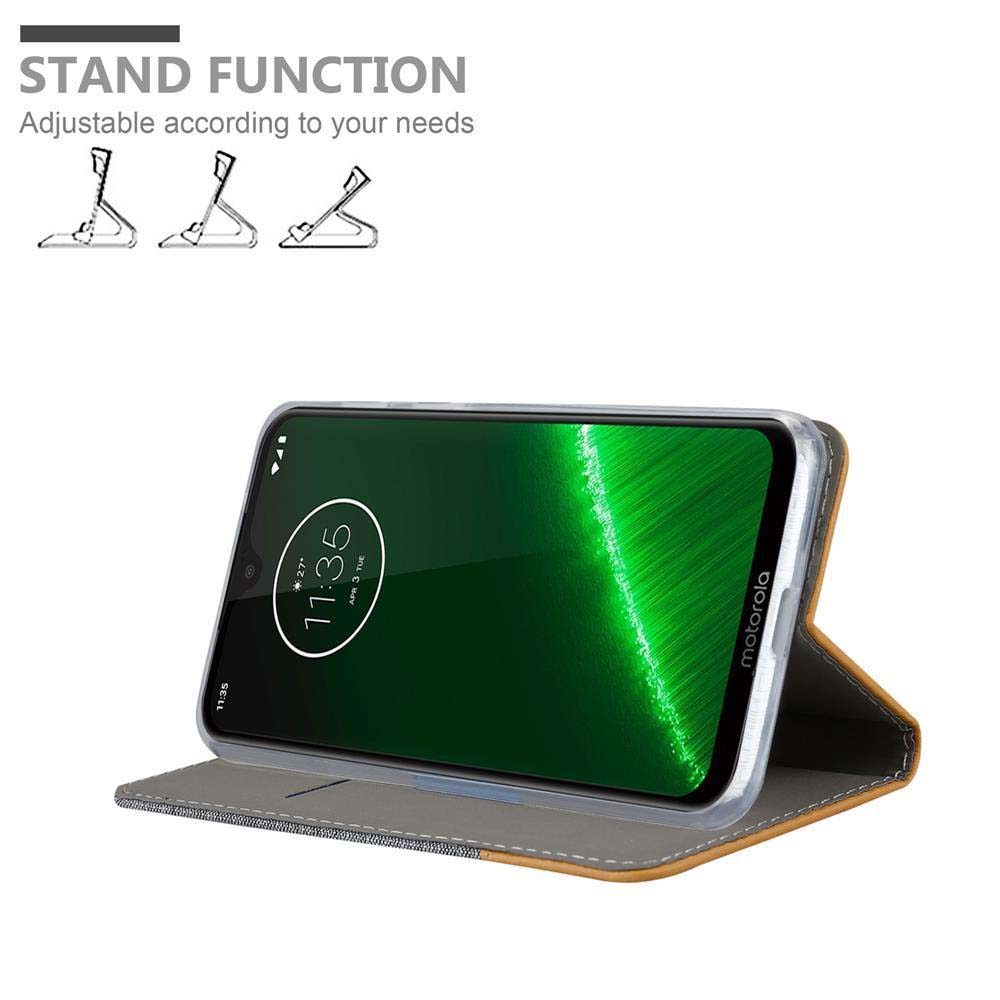 Un telefono in una custodia marrone con funzione stand, che mostra le 11:35.