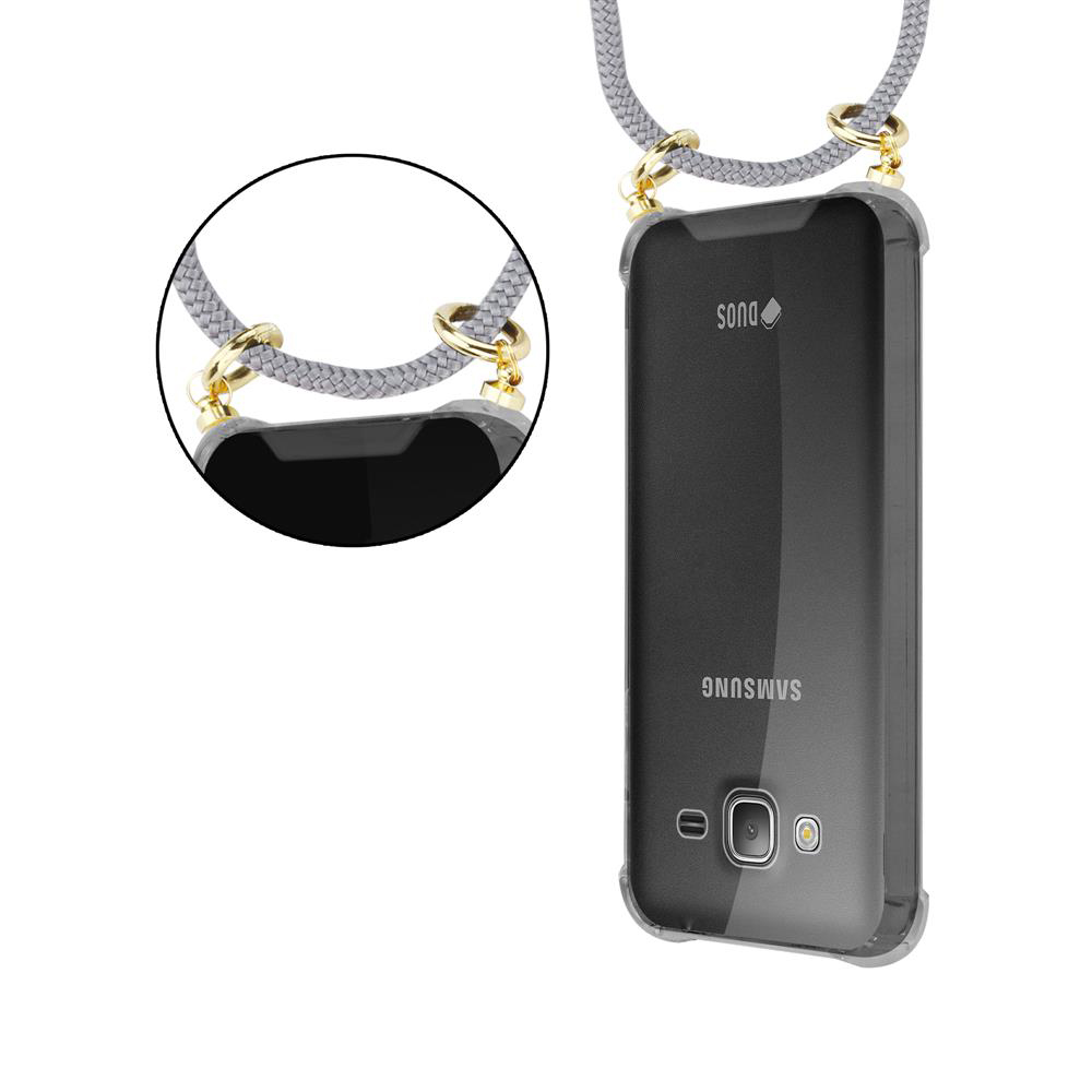 Un telefono Samsung nero con laccetto e un primo piano dell'attacco.