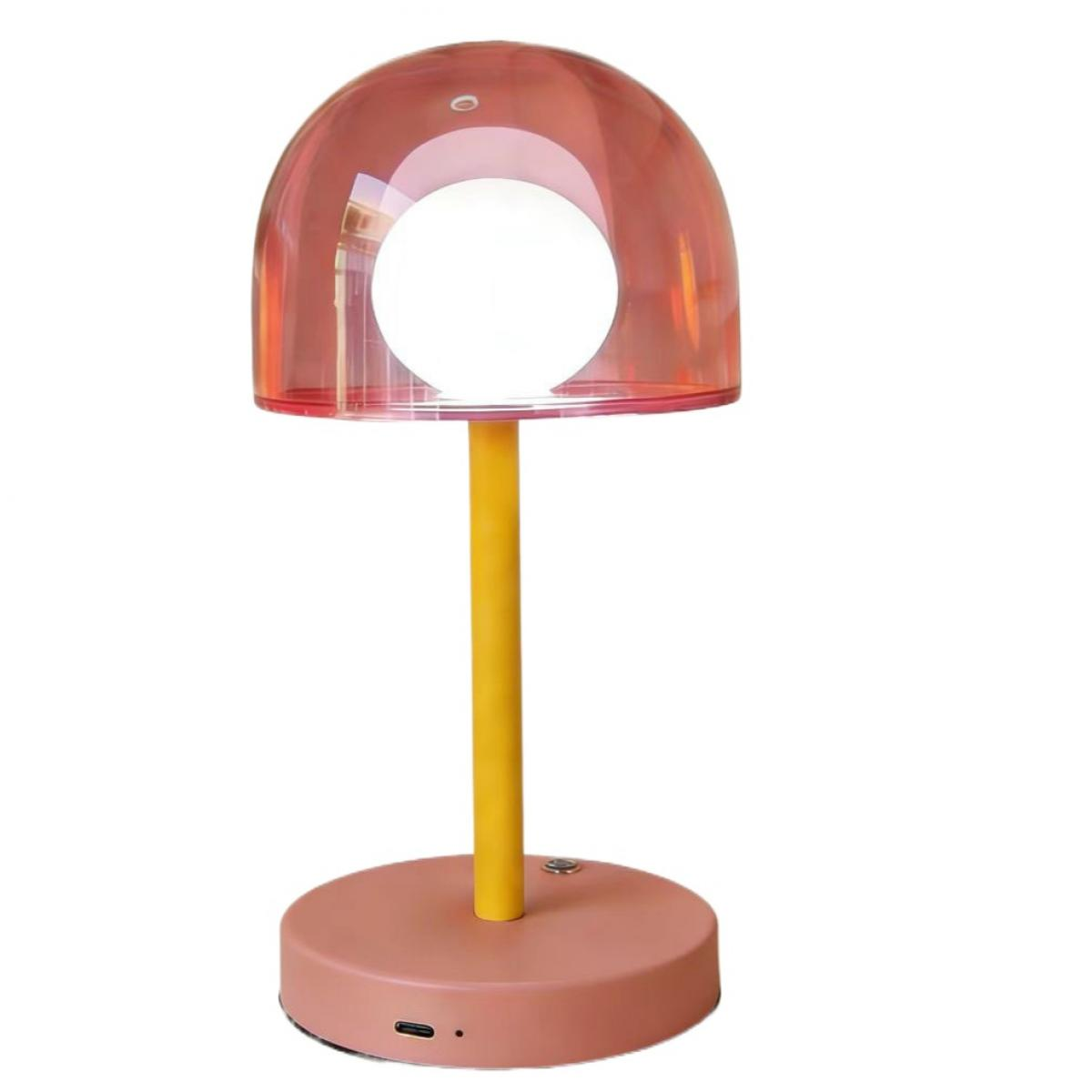 Eine rosafarbene Lampe mit gelbem Stiel auf runder Basis.