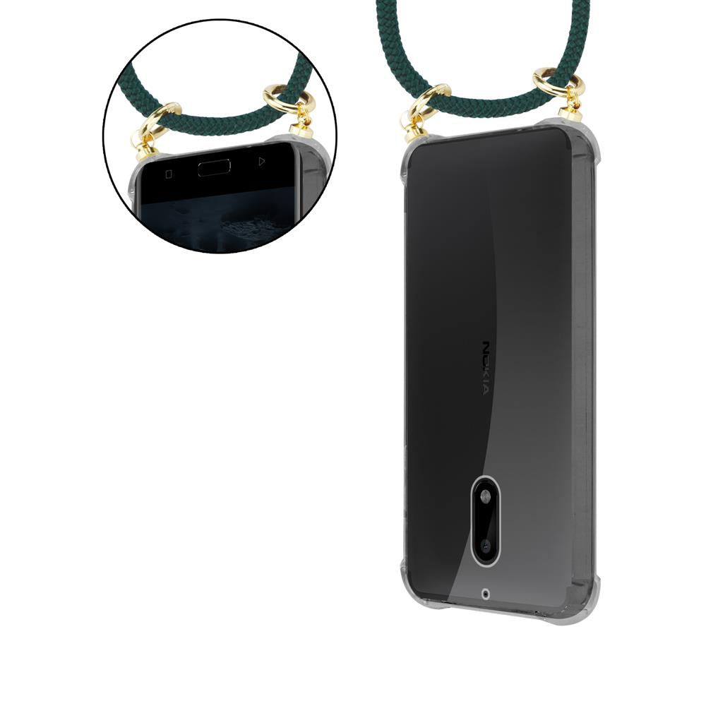 Transparente Handyhülle mit grüner Trageschlaufe an goldenen Ringen. Nahaufnahme des Handybildschirms.