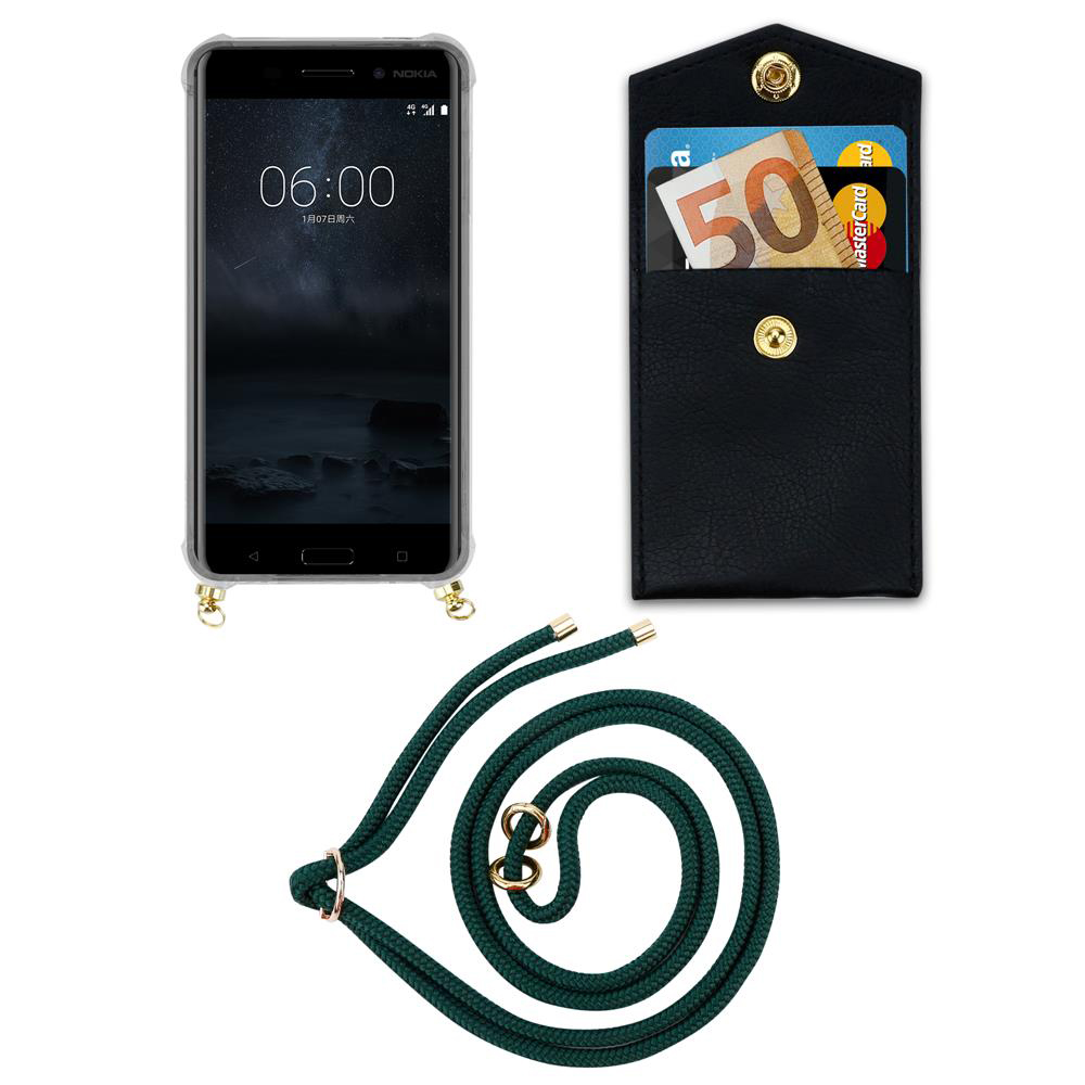 Ein Smartphone, eine schwarze Geldbörse mit Karten und Geld, und ein grünes Band.