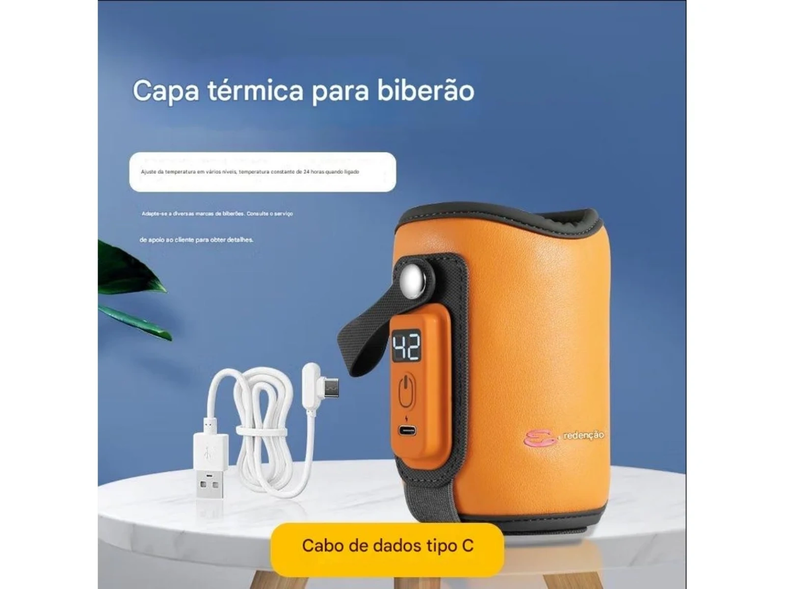 Orange Flaschenwärmer mit Display, USB-Kabel auf weißem Tisch.