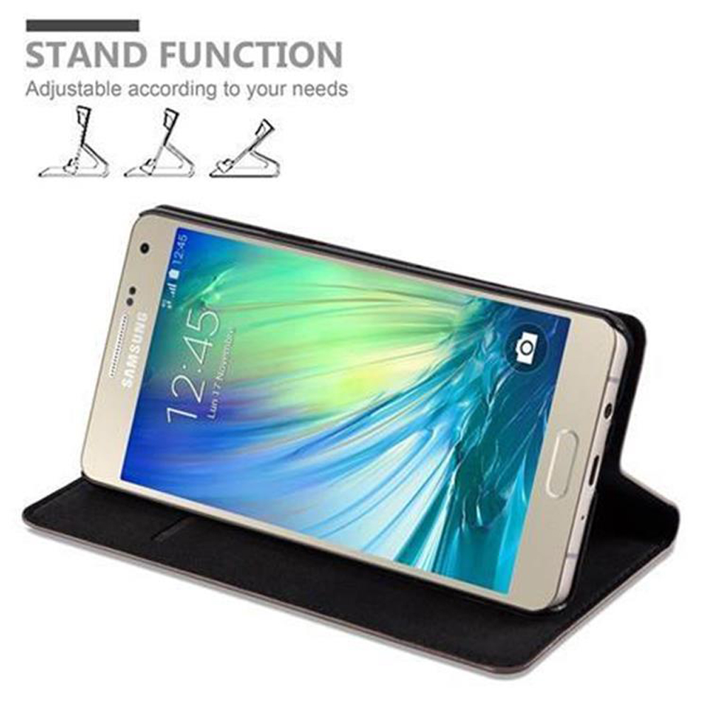 Uno smartphone in un supporto nero. In alto sono mostrate tre icone di supporto.