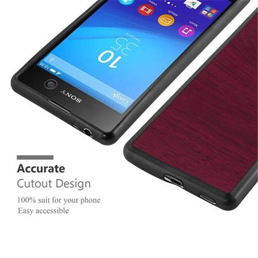 Un smartphone con una funda de veta de madera roja junto a un teléfono Sony.