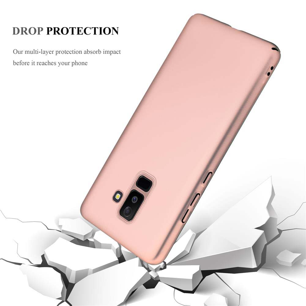 Ein roségoldenes Handycase fällt auf weiße, zerbrochene Blöcke.