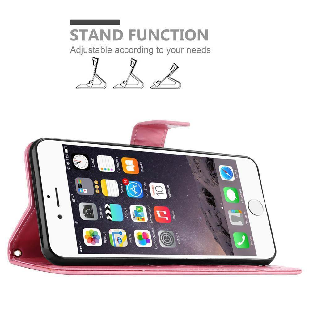 Un iPhone rosa in una custodia che funge da supporto, con icone di app sullo schermo.