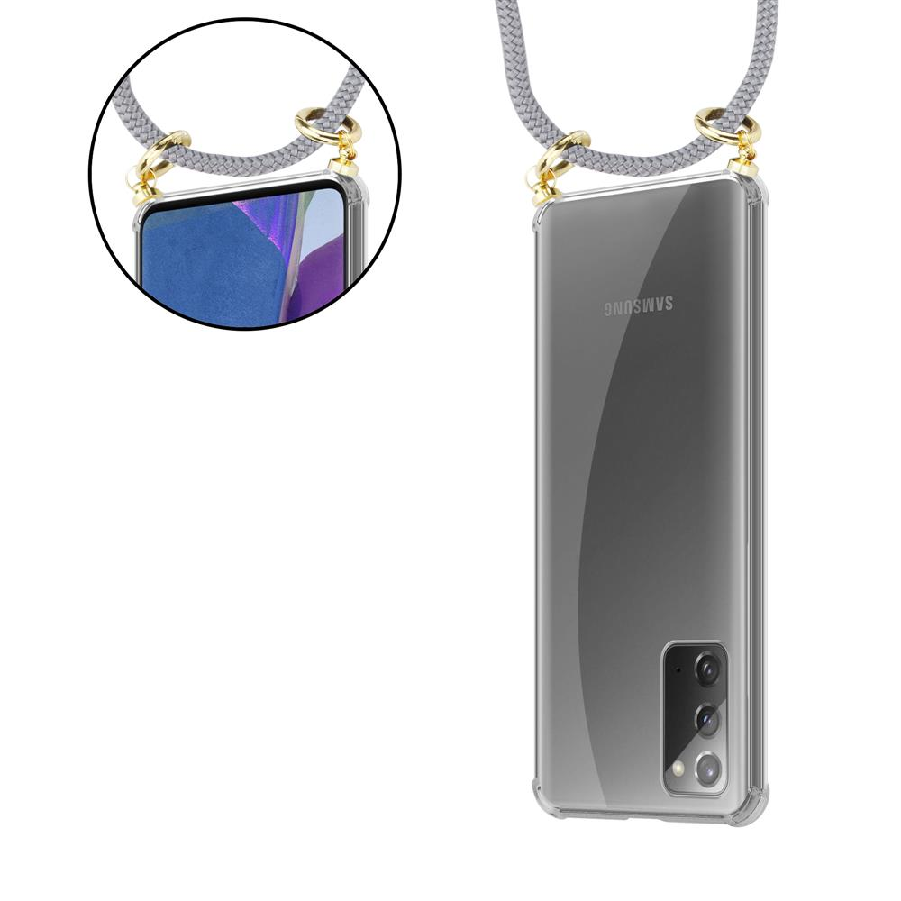 Custodia trasparente per telefono Samsung con cordino grigio e hardware dorato.
