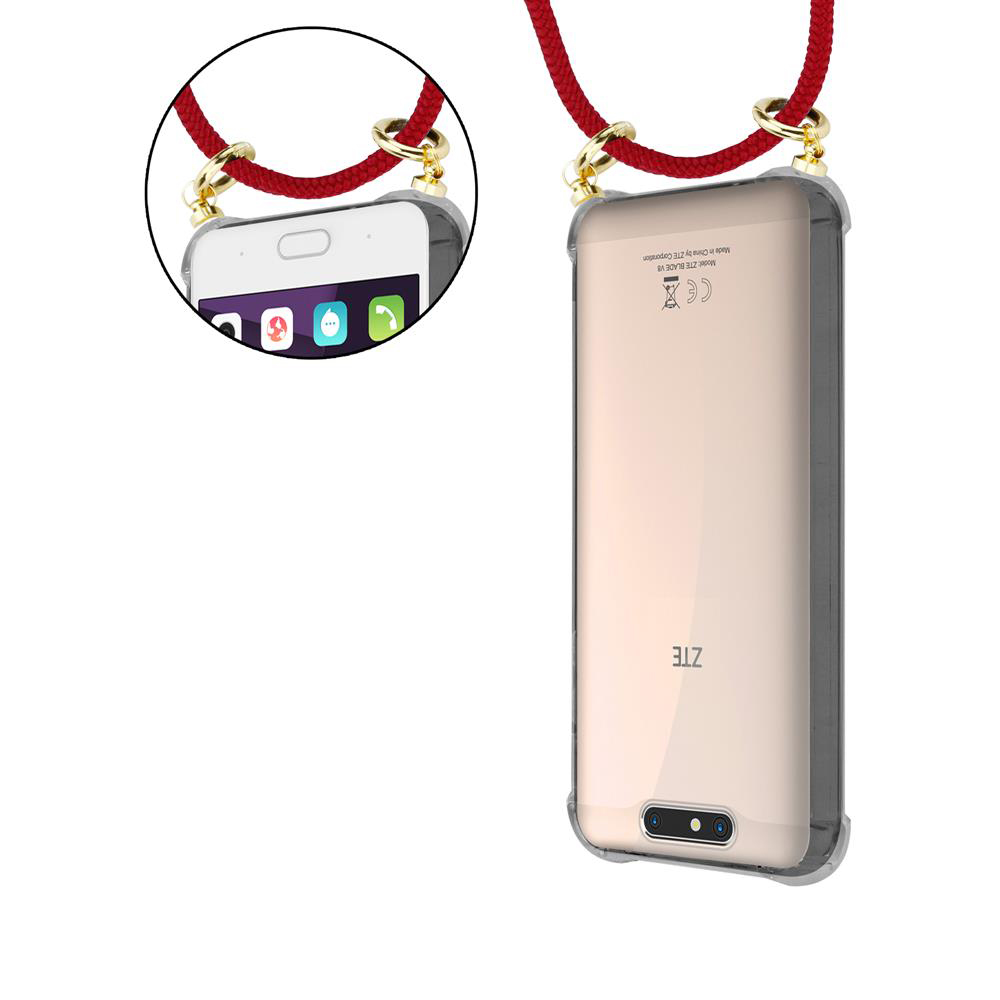 Ein Smartphone mit einem roten Band, das mit goldenen Ringen befestigt ist.