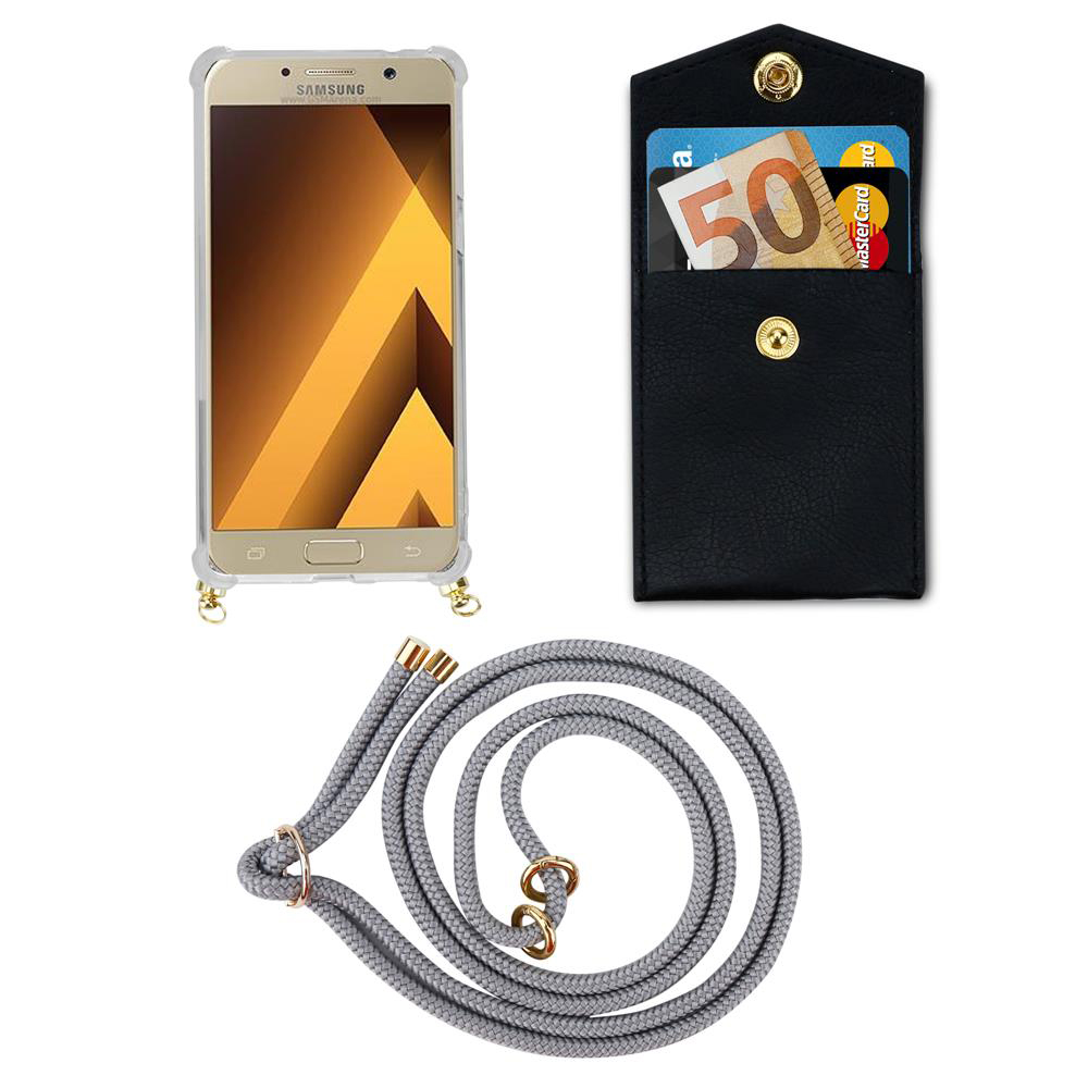 Custodia dorata Samsung con laccetto, portafoglio nero con soldi e carte.