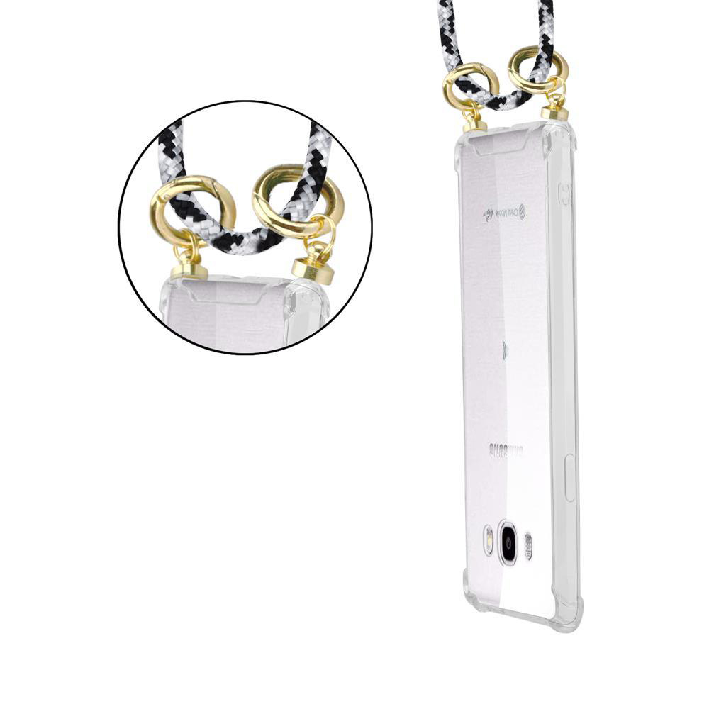 Una custodia trasparente per telefono con cinturino bianco e nero e hardware dorato.