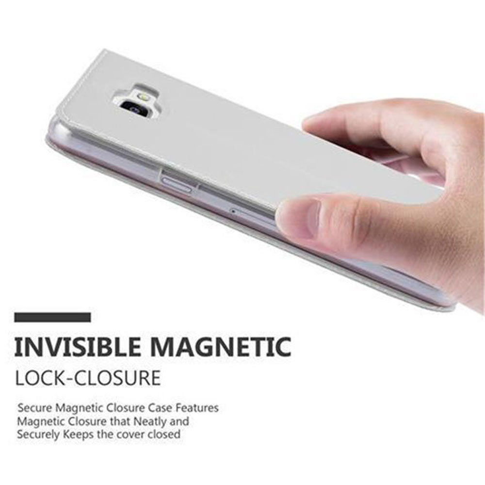 Una mano tiene un telefono grigio chiaro con custodia a chiusura magnetica.