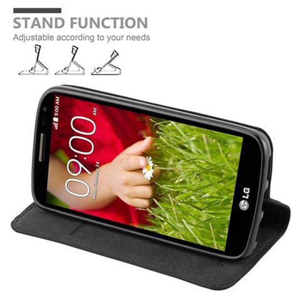 Smartphone in schwarzem Case mit Standfunktion und Gras-Hintergrund.