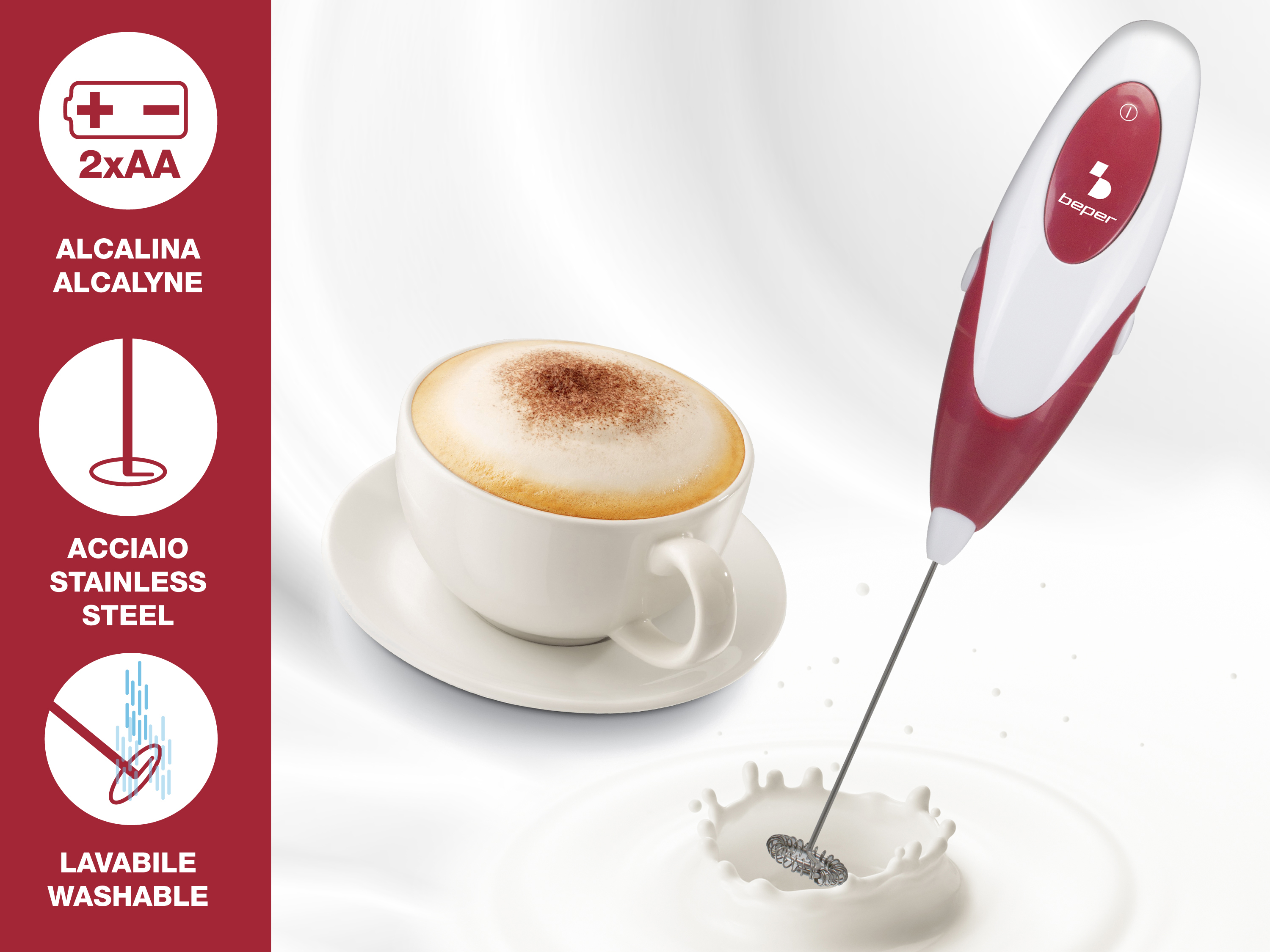 Una tazza bianca di cappuccino accanto a un montalatte rosso e bianco.