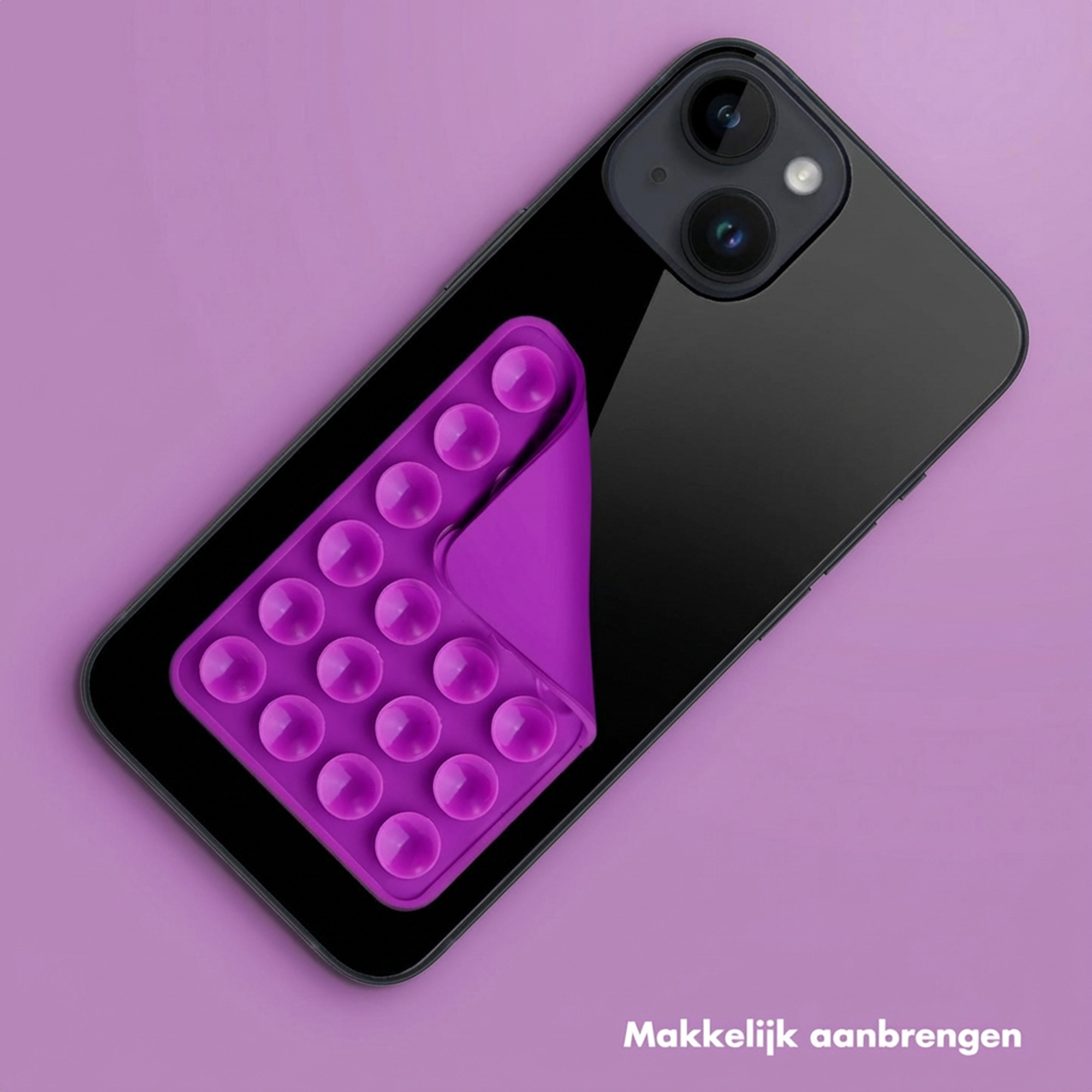 Paarse Pop-It houder op zwarte smartphone tegen paarse achtergrond.