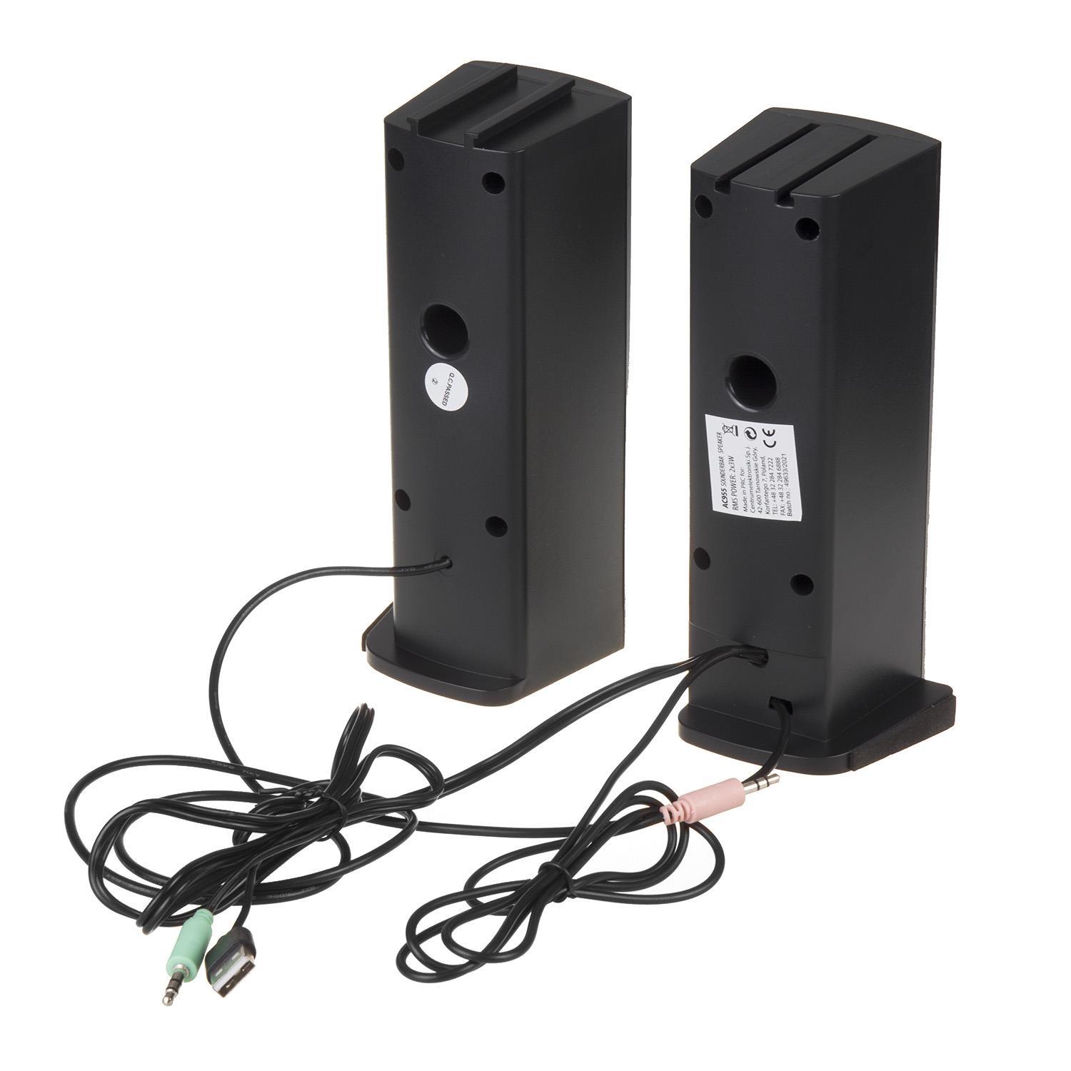 Dos altavoces negros con cables y enchufes sobre fondo blanco.