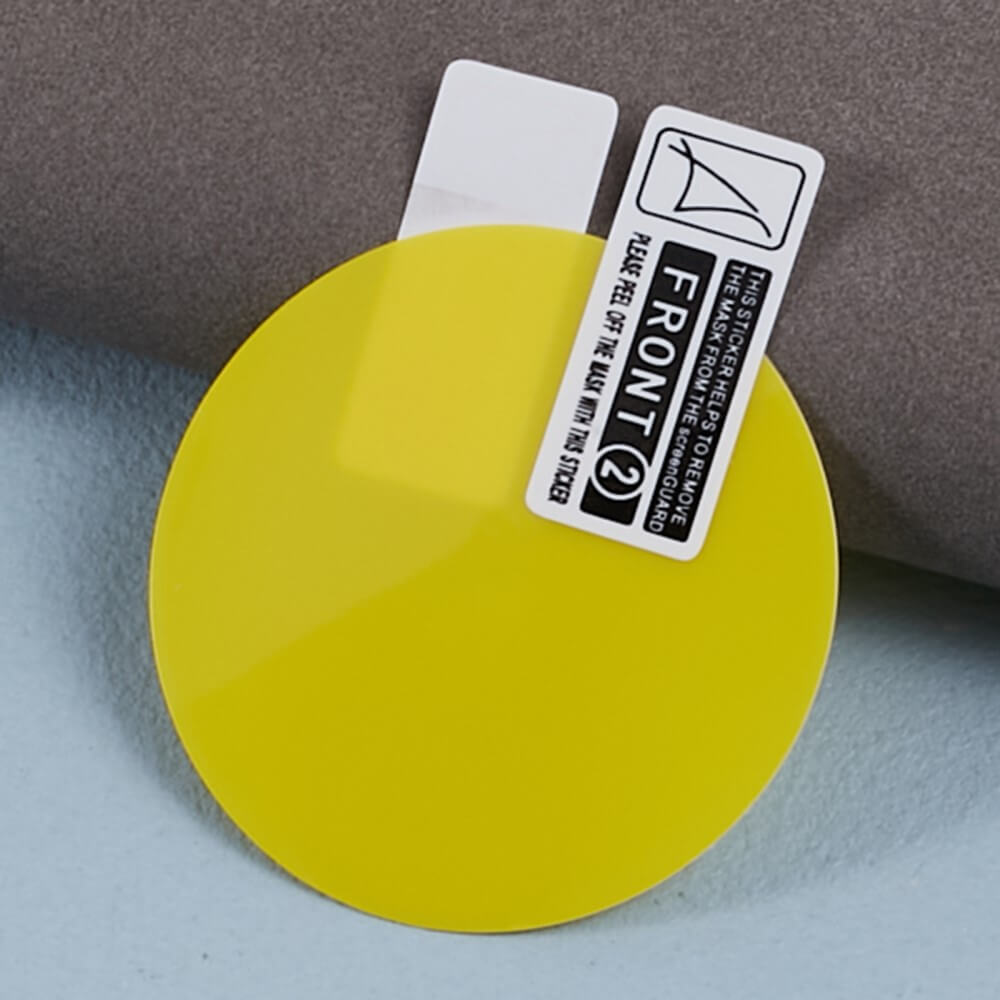 Protection d'écran jaune avec autocollant 'FRONT 2' sur fond gris.