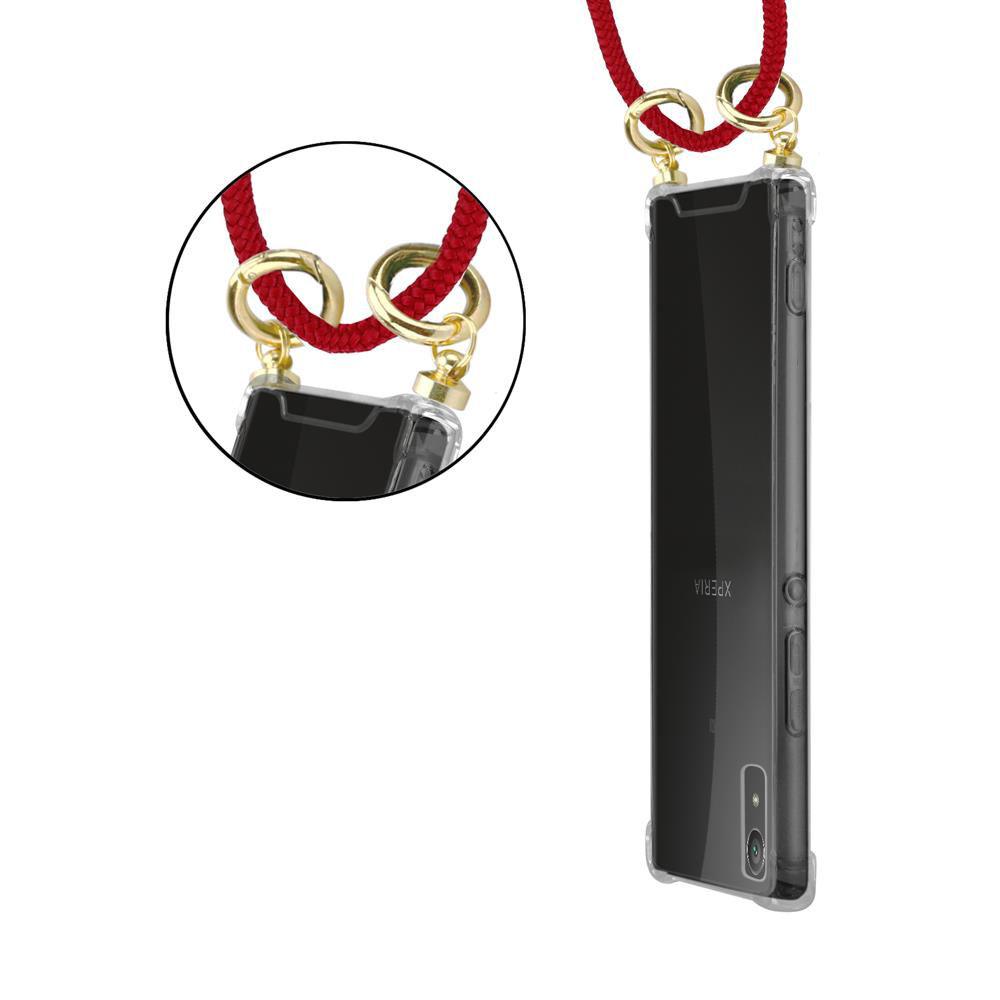 Ein transparentes Handyhülle mit rotem Band und goldenen Ringen.