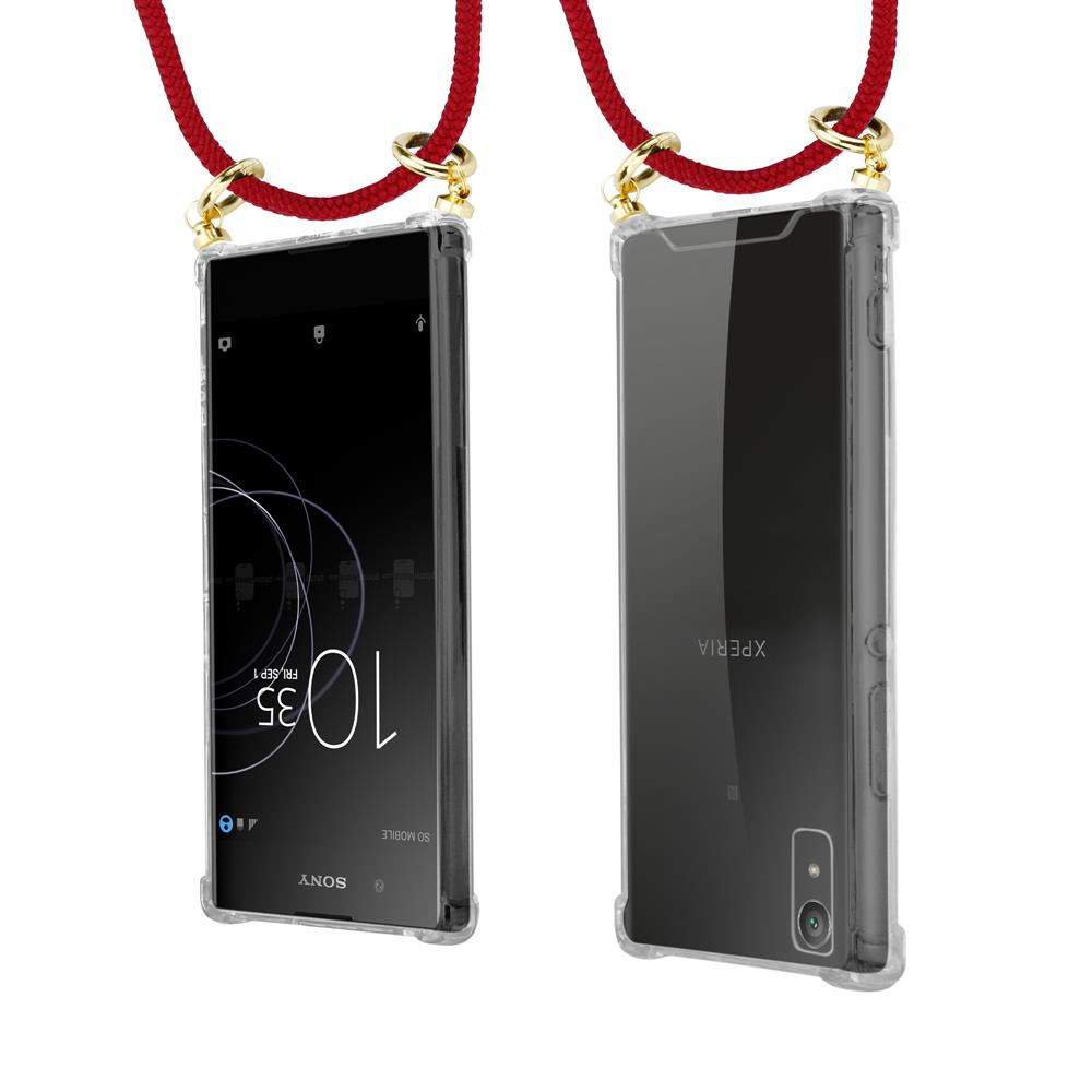 Ein durchsichtiges Handycase mit rotem Band und goldenen Beschlägen.