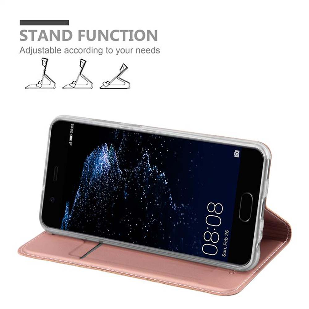Un telefono in una custodia rosa sta in piedi.