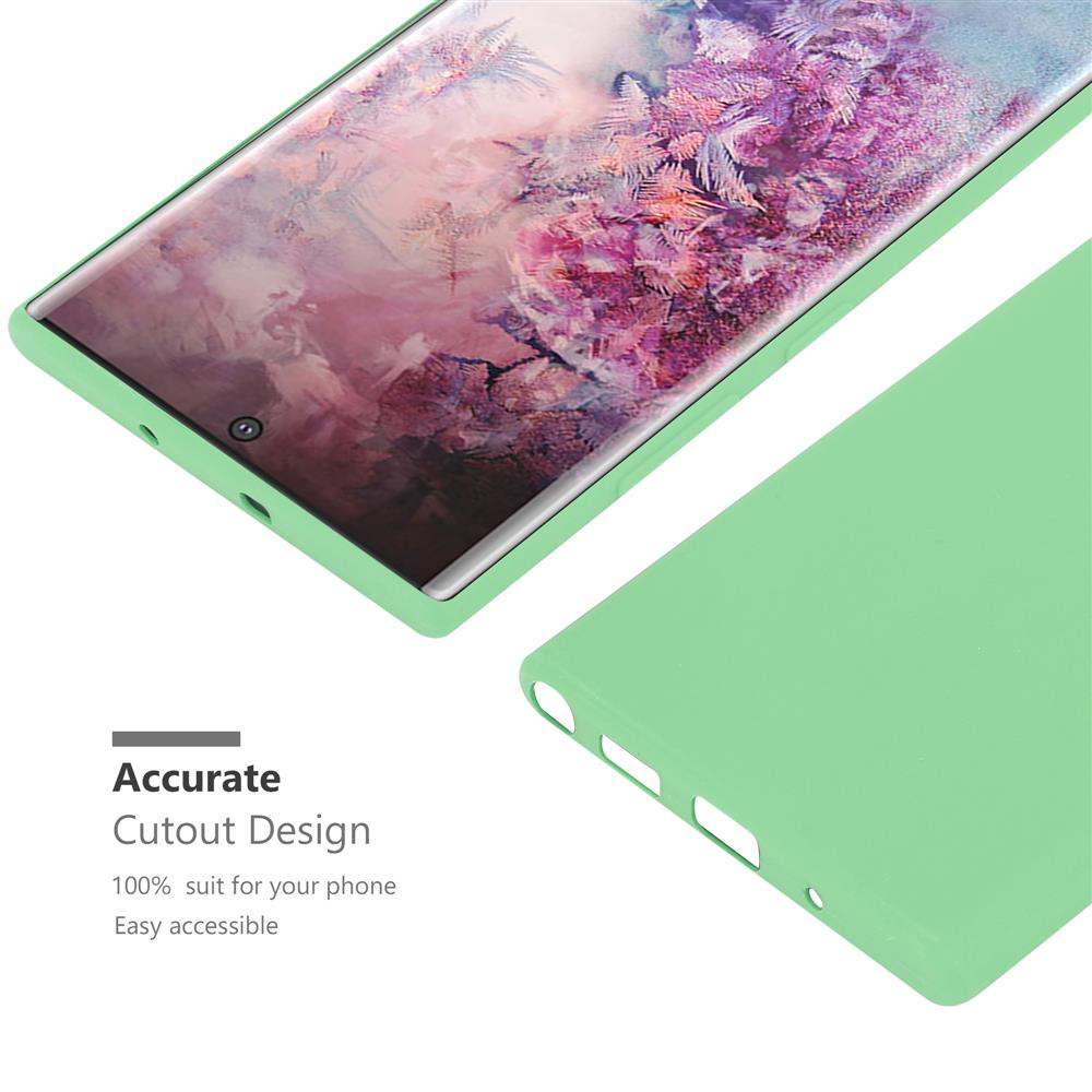Una cover verde chiaro giace accanto a uno smartphone con sfondo colorato.