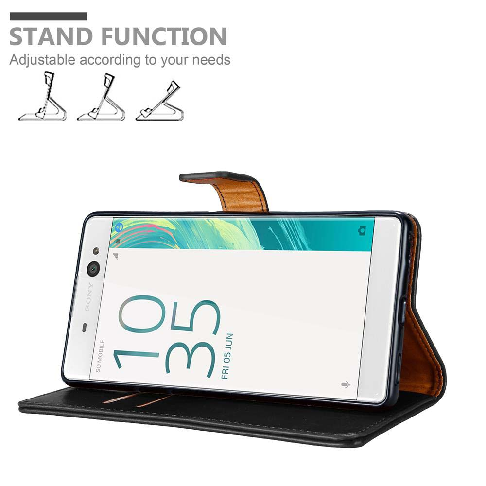 Telefono in custodia nera e marrone, mostra ora 10:35 e data. Funzione stand.