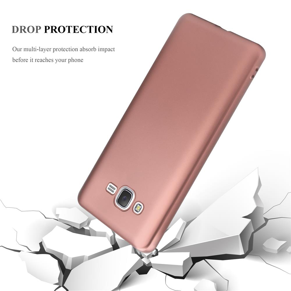 Ein roségoldenes Handy-Case fällt auf zerbrochenen Boden.