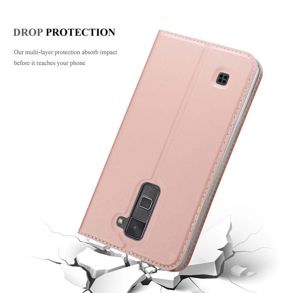 Custodia rosa per telefono con ritaglio fotocamera su fondo rotto.