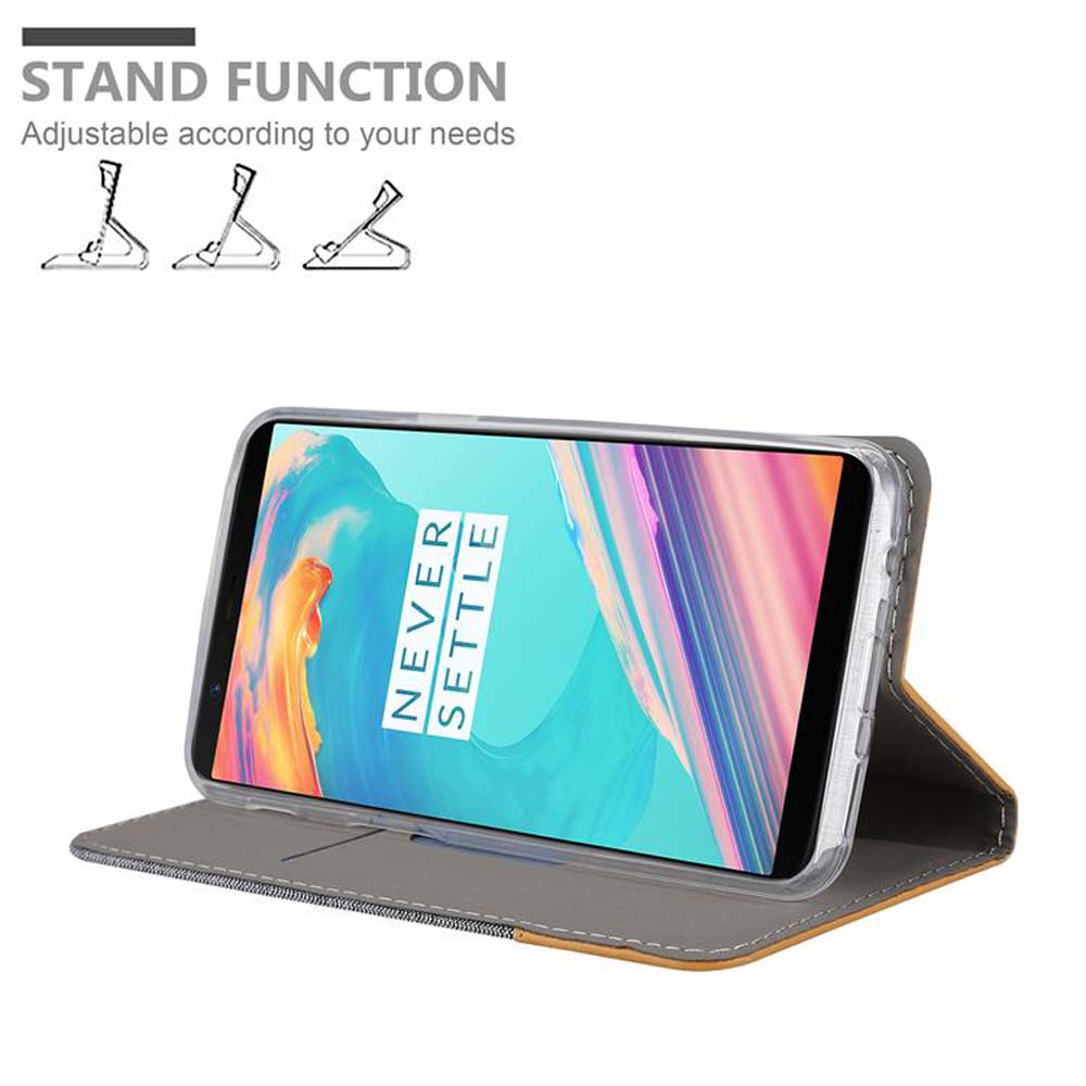 Graues Handycover mit integriertem Ständer, das ein Smartphone hält.