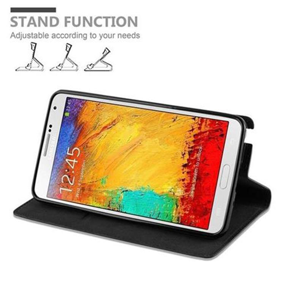 Uno smartphone in una custodia nera che funge da supporto. L'ora è 12:45.