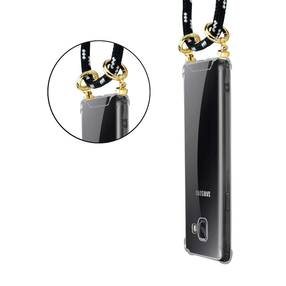 Funda transparente para teléfono con cordón blanco y negro y herrajes dorados.