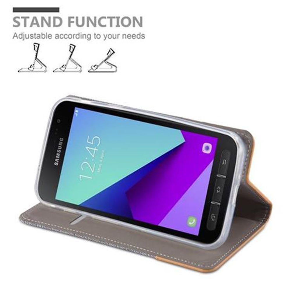 Un telefono Samsung in una custodia grigia che funge da supporto.