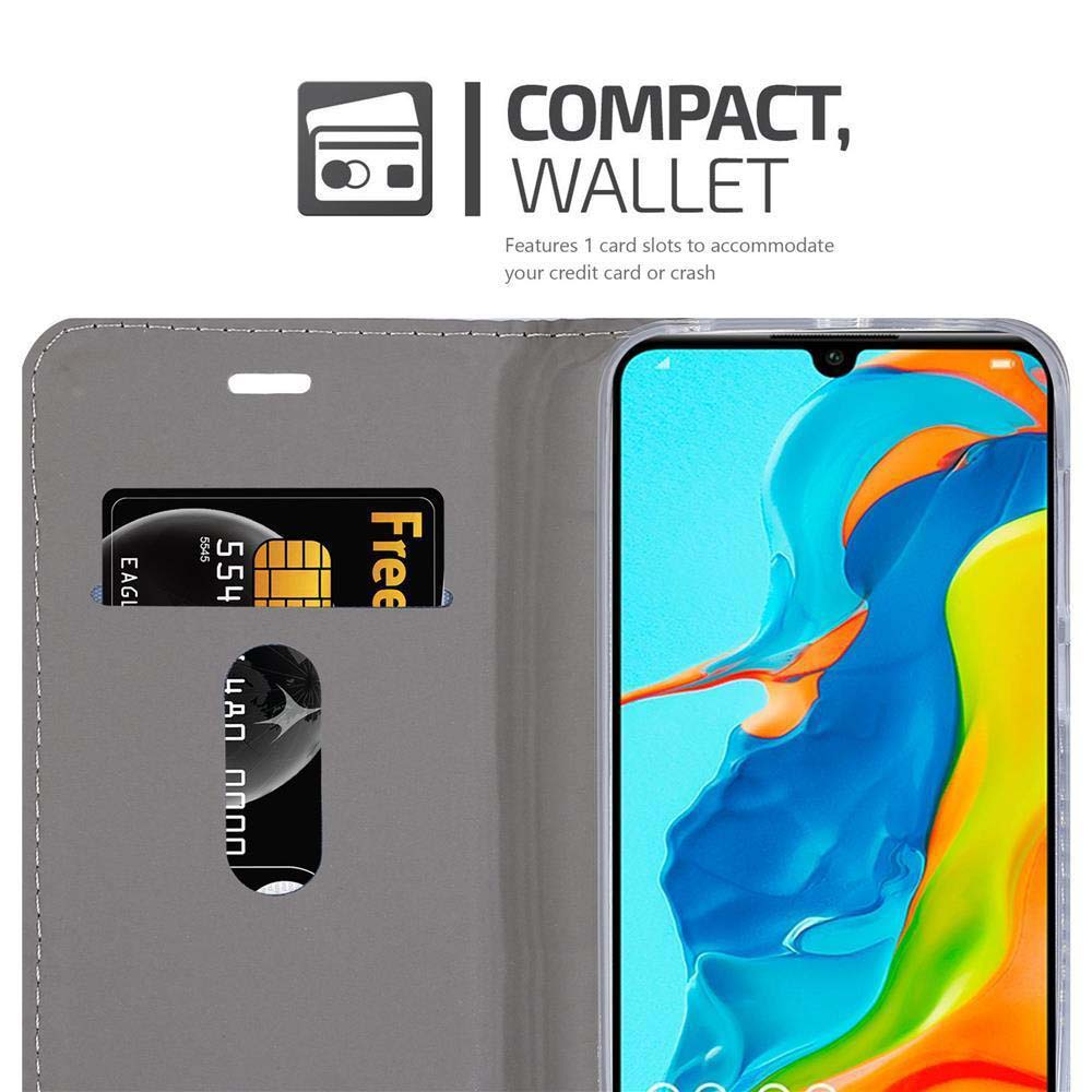 Un portafoglio grigio contiene un telefono con schermo colorato e due carte.