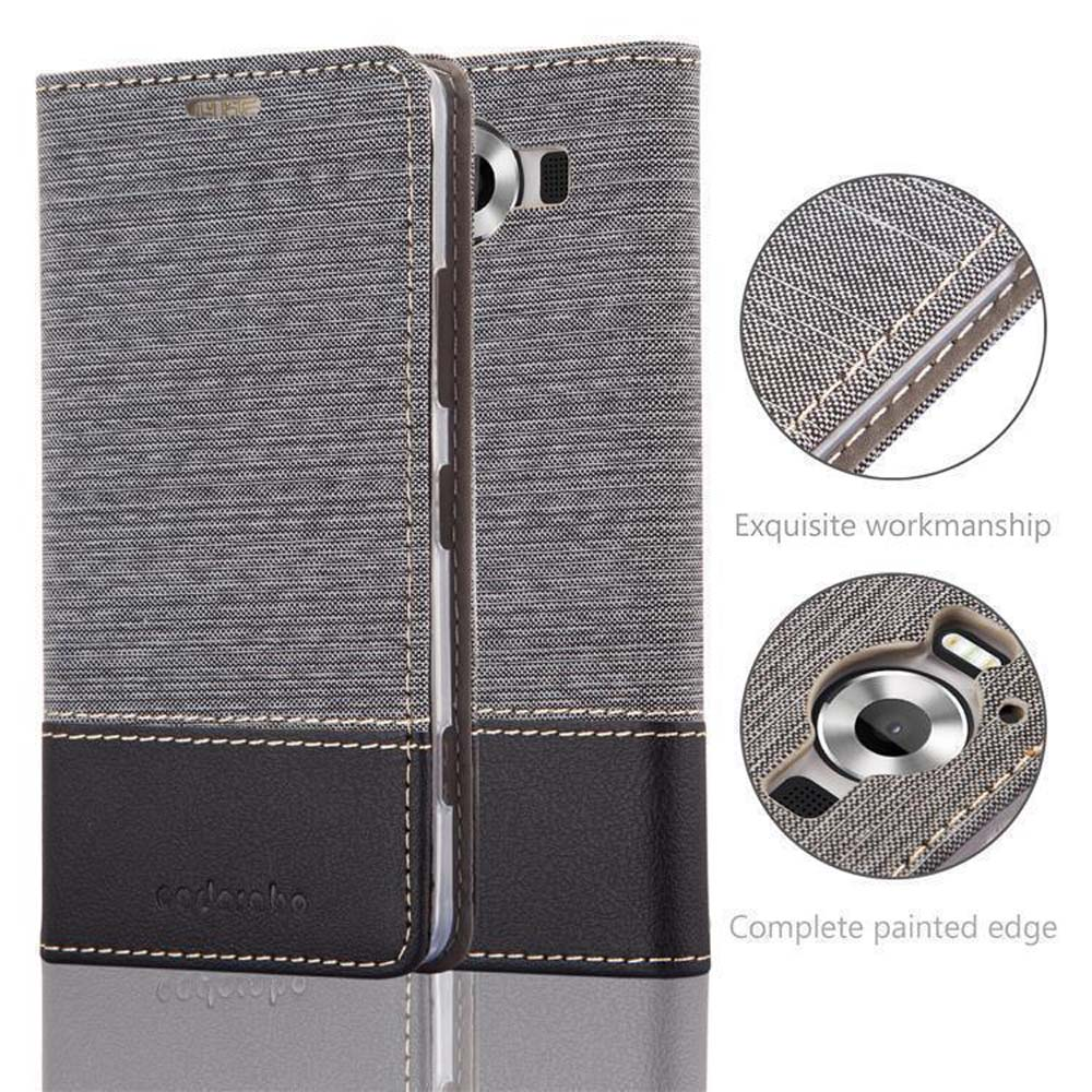 Custodia per telefono in tessuto grigio con base in pelle nera.