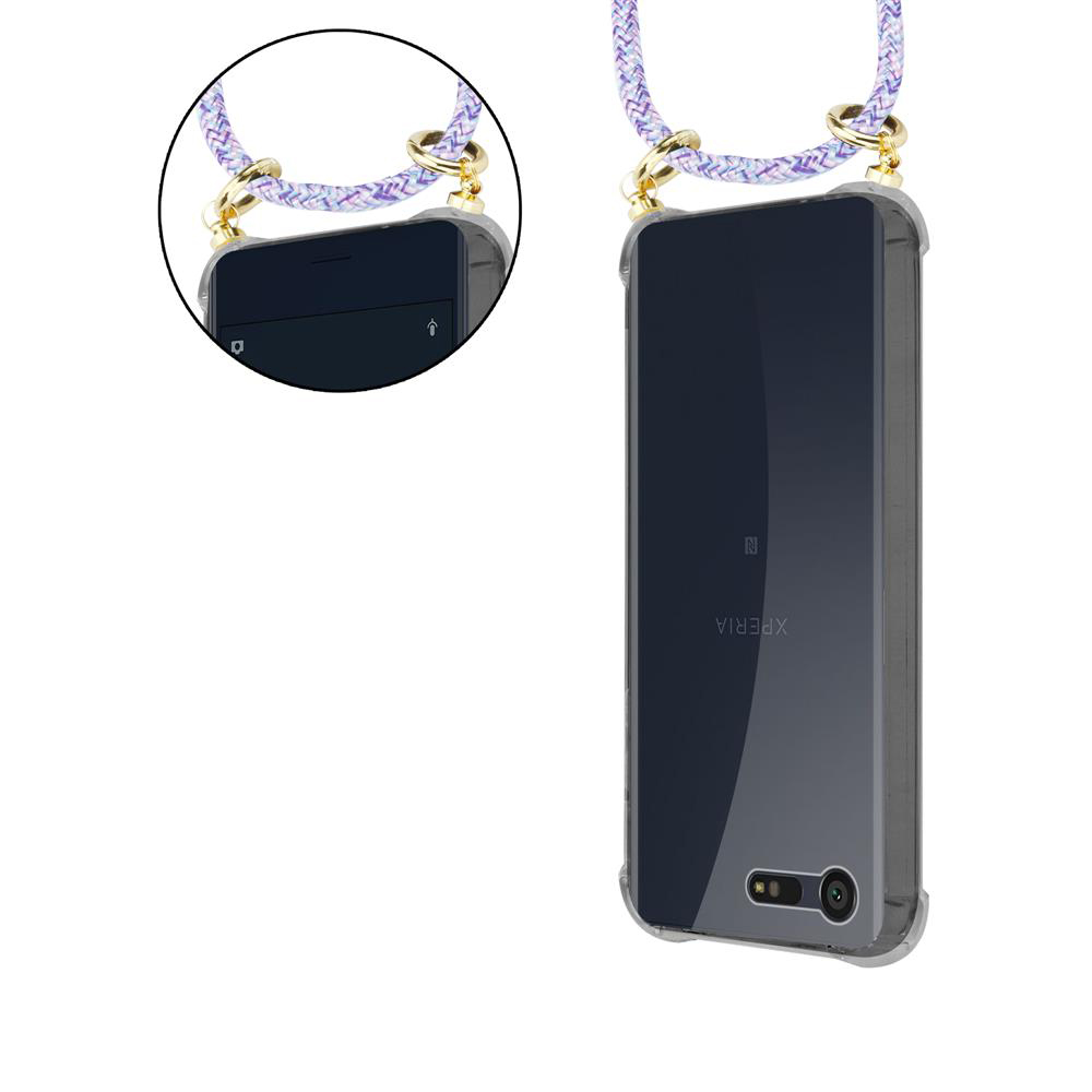Un smartphone en funda transparente con cordón morado y blanco.