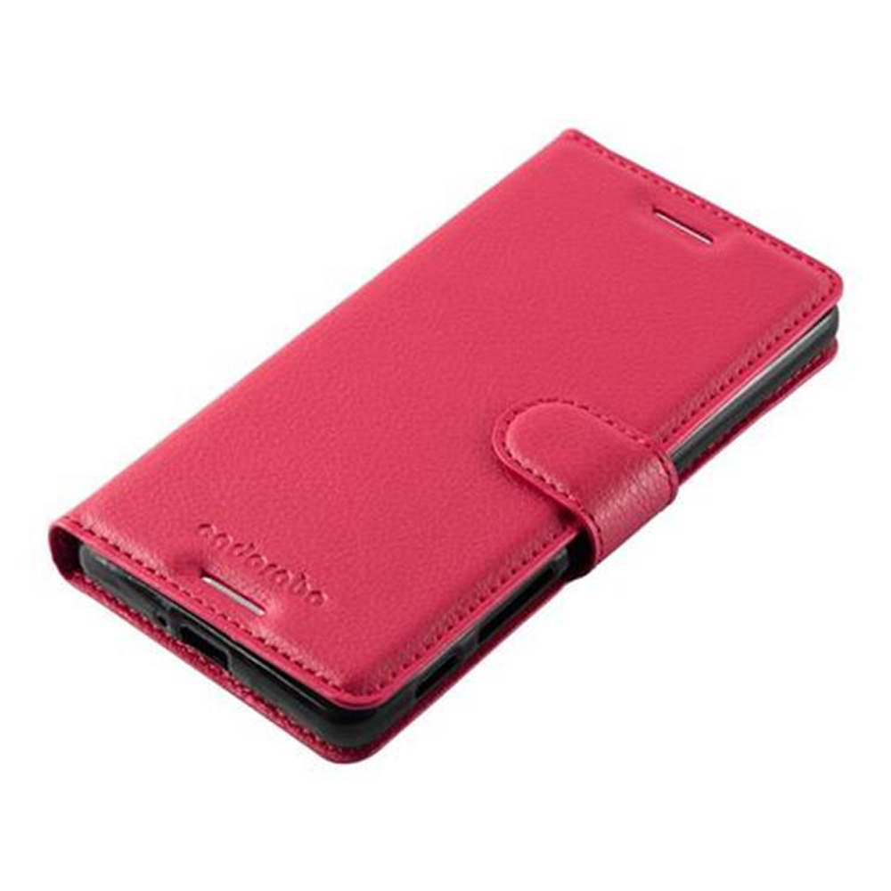 Una custodia a libro per telefono in pelle rosa con chiusura a scatto.