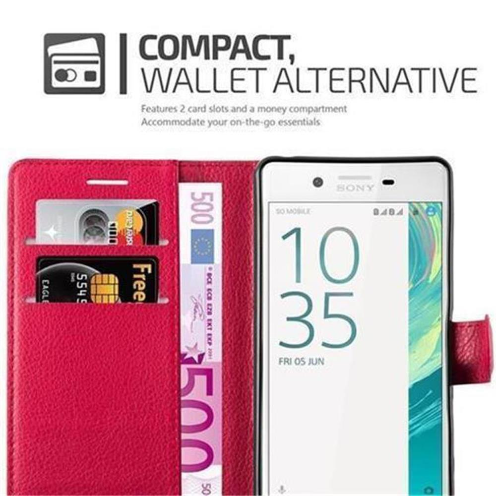Custodia a portafoglio rossa con telefono, soldi e carte.