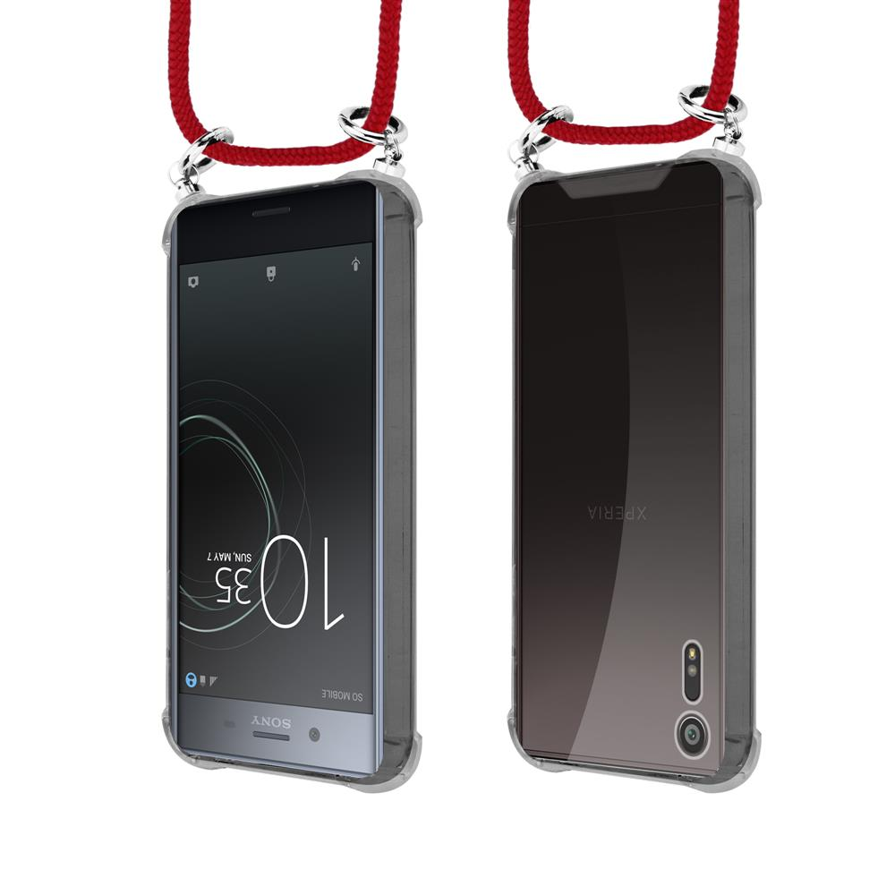 Due smartphone con cordino rosso e anelli argentati, vista frontale e posteriore.