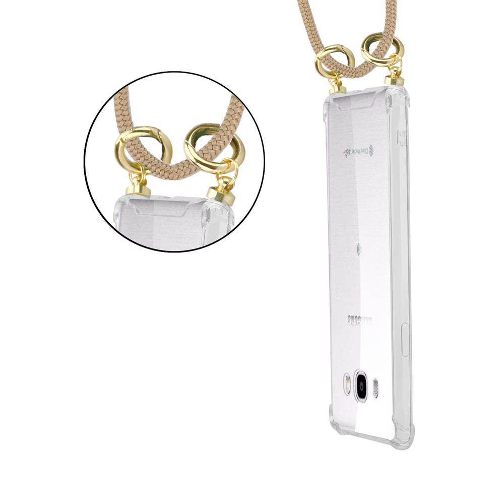 Custodia trasparente per telefono con tracolla beige e dettagli dorati.