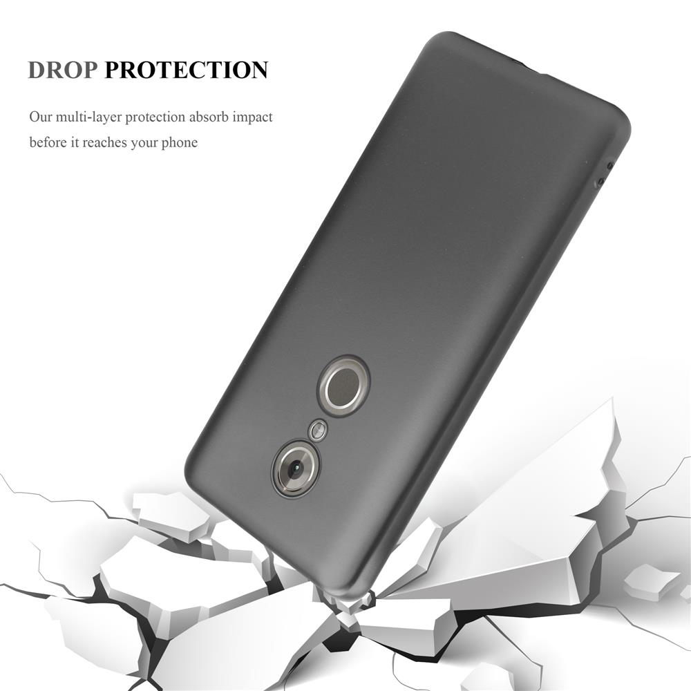 Graues Handy fällt durch weiße zerbrochene Oberfläche.
