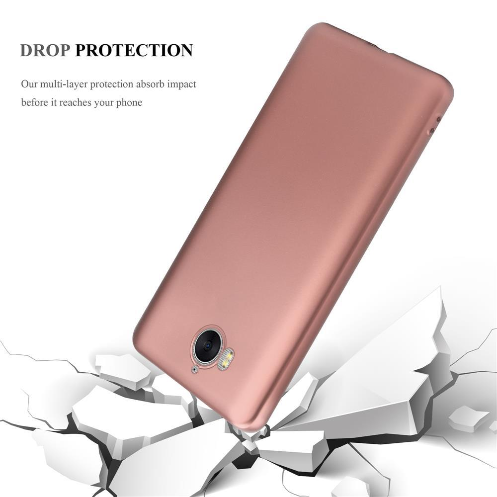 Ein roségoldenes Handy fällt durch eine zerbrochene weiße Oberfläche.