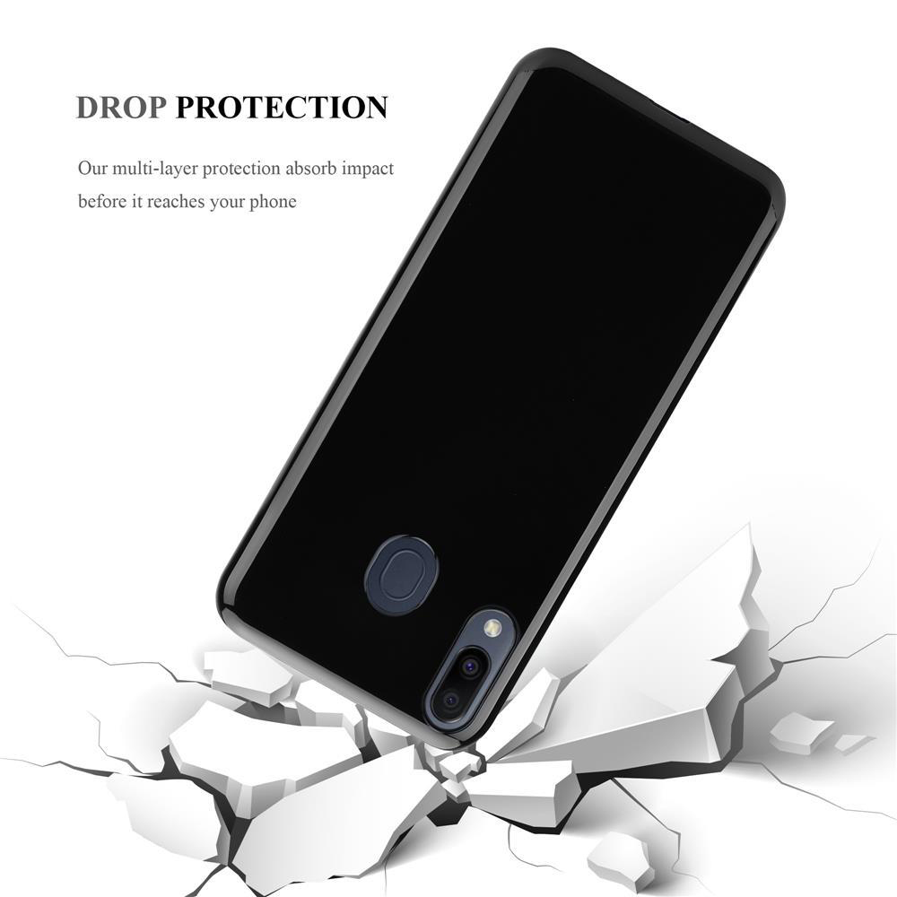 Ein schwarzes Handy mit Hülle bricht durch weiße Steine.