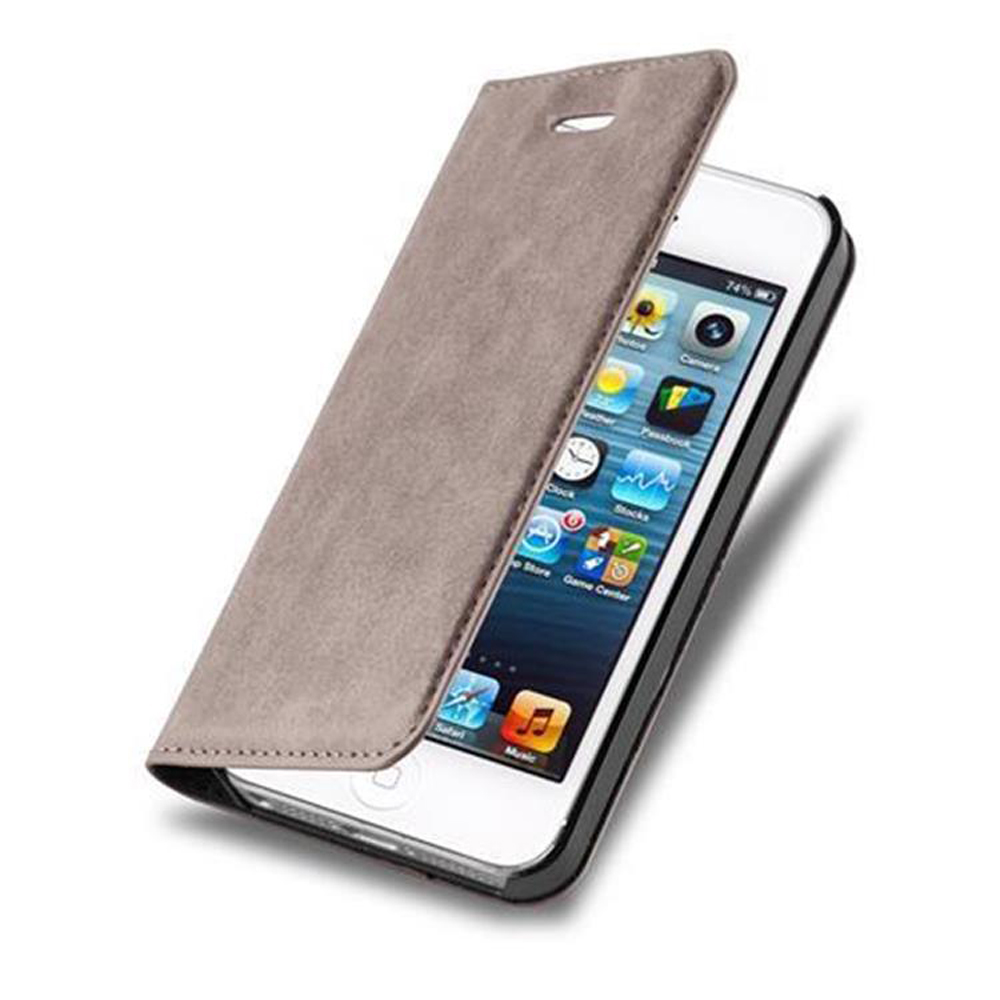 Una custodia a flip grigia si apre su uno smartphone bianco con app.