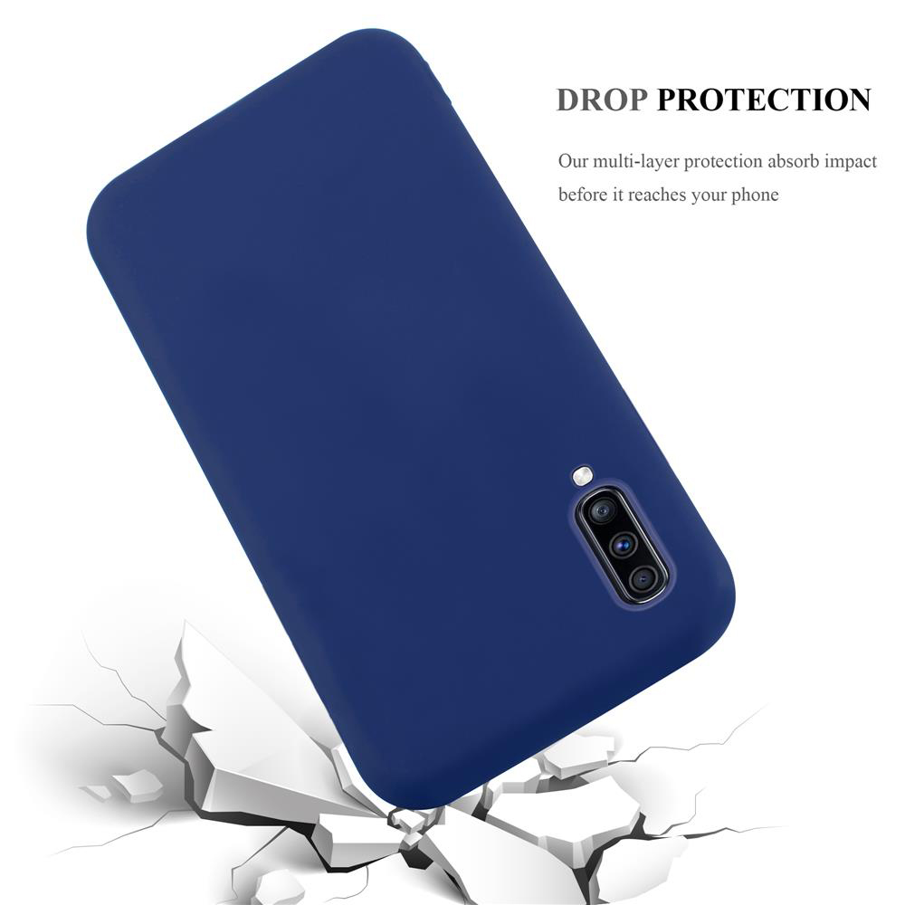 Dunkelblaue Handyhülle bricht weiße Felsen, "DROP PROTECTION" Text.
