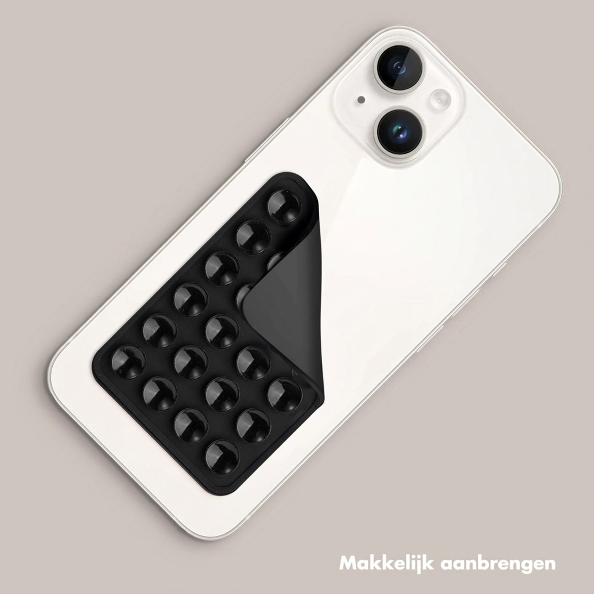 Een witte smartphone met een zwarte zuignaphouder op de achterkant.